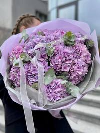 Bright and large bouquet with purple hydrangeas