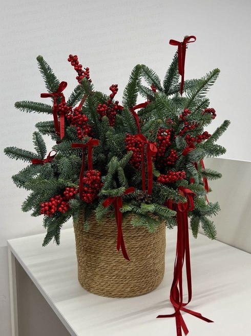 Christmas arrangement in a wicker flowerpot size L